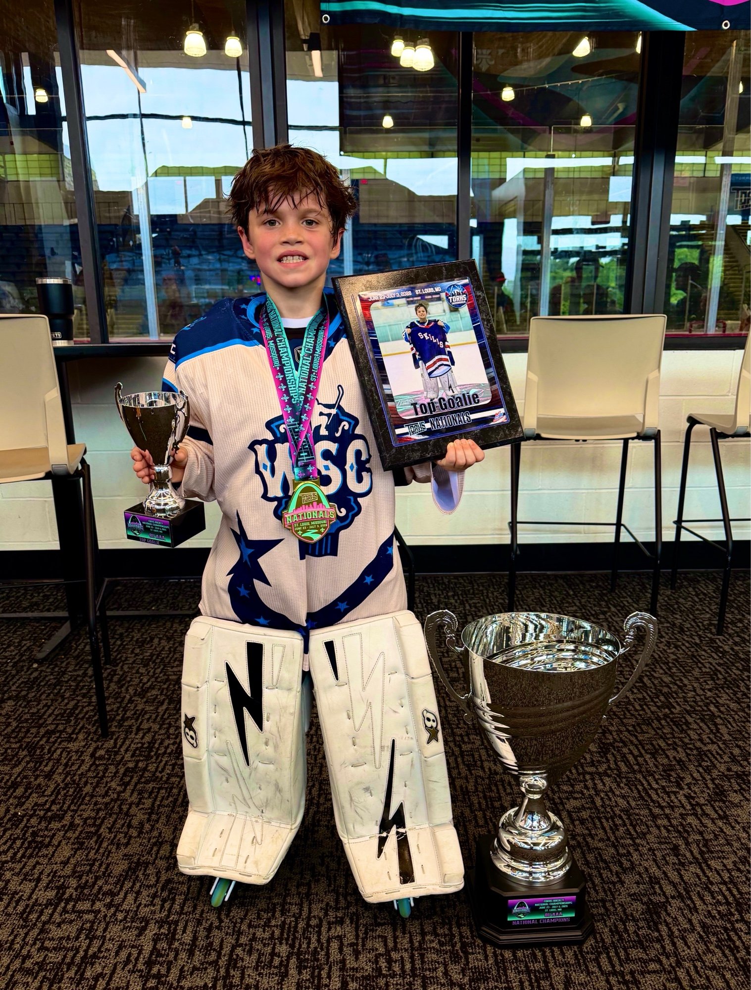 Jack with the 2026 TORHS National Champion trophy and Top Goalie plaque